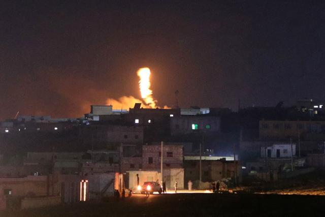 A fireball rises following an explosion at a Syrian army site in the vicinity of Al-Eis town early on September 21, 2026. At least four people were injured following a series of explosions at an Aleppo army site in northern Syria, state media reported. The cause of the explosions was not immediately known. (Photo by Abdulaziz KETAZ / AFP)