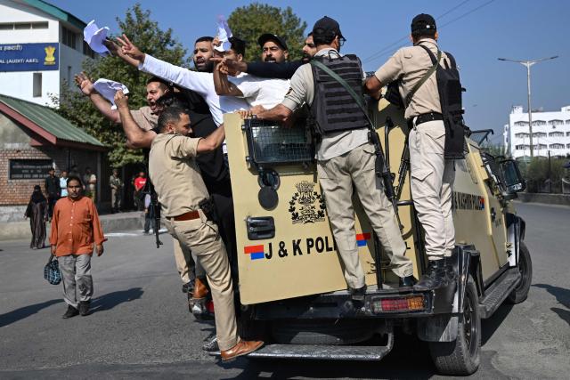 Police personnel detain supporters of the Jammu and Kashmir Apni Party (JKAP) during a protest against the government demanding employment for youth and basic amenities in Srinagar on September 21, 2026. (Photo by Tauseef MUSTAFA / AFP)
