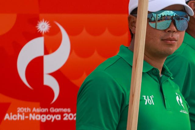 An official looks on during the men's beach volleyball competition during the 2026 Asian Games at the Hekinan Ryokuchi Beach Court in Hekinan, Aichi prefecture on September 21, 2026. (Photo by DAVID GRAY / AFP)