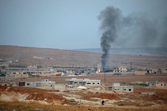 Smoke billows following a series of explosions at a Syrian army site in the vicinity of Al-Eis town on September 21, 2026. At least four people were injured following a series of explosions at an Aleppo army site in northern Syria, state media reported. The cause of the explosions was not immediately known. (Photo by Abdulaziz KETAZ / AFP)