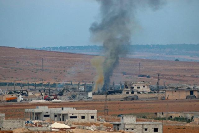 Smoke billows following a series of explosions at a Syrian army site in the vicinity of Al-Eis town on September 21, 2026. At least four people were injured following a series of explosions at an Aleppo army site in northern Syria, state media reported. The cause of the explosions was not immediately known. (Photo by Abdulaziz KETAZ / AFP)