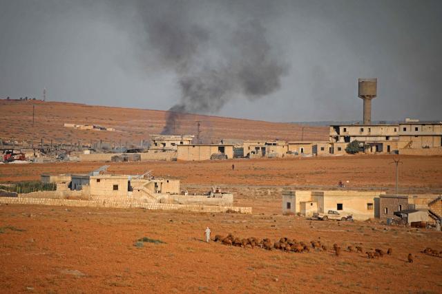 Smoke billows following a series of explosions at a Syrian army site in the vicinity of Al-Eis town on September 21, 2026. At least four people were injured following a series of explosions at an Aleppo army site in northern Syria, state media reported. The cause of the explosions was not immediately known. (Photo by Abdulaziz KETAZ / AFP)