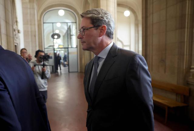 German former Transport Minister Andreas Scheuer arrives for his trial about allegedly false statements at a federal parliamentary investigative committee on the country's car toll affair, at the Regional Court in Berlin on September 21, 2026. In connection with the failed motorway toll, Scheuer will have to answer to the Berlin Regional Court on charges of alleged false testimony. The statement in question, made before a parliamentary committee of inquiry, concerns the question of whether contracts with toll operators were signed even though there was a risk that the project would be stopped by the European Court of Justice (ECJ). (Photo by Odd ANDERSEN / AFP)