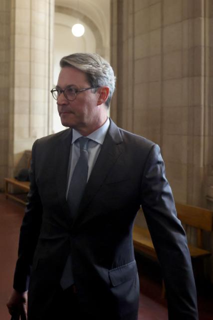 German former Transport Minister Andreas Scheuer arrives for his trial about allegedly false statements at a federal parliamentary investigative committee on the country's car toll affair, at the Regional Court in Berlin on September 21, 2026. In connection with the failed motorway toll, Scheuer will have to answer to the Berlin Regional Court on charges of alleged false testimony. The statement in question, made before a parliamentary committee of inquiry, concerns the question of whether contracts with toll operators were signed even though there was a risk that the project would be stopped by the European Court of Justice (ECJ). (Photo by Odd ANDERSEN / AFP)