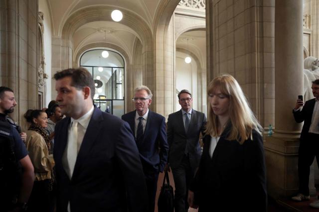 German former Transport Minister Andreas Scheuer (C-R) arrives for his trial about allegedly false statements at a federal parliamentary investigative committee on the country's car toll affair, at the Regional Court in Berlin on September 21, 2026. In connection with the failed motorway toll, Scheuer will have to answer to the Berlin Regional Court on charges of alleged false testimony. The statement in question, made before a parliamentary committee of inquiry, concerns the question of whether contracts with toll operators were signed even though there was a risk that the project would be stopped by the European Court of Justice (ECJ). (Photo by Odd ANDERSEN / AFP)
