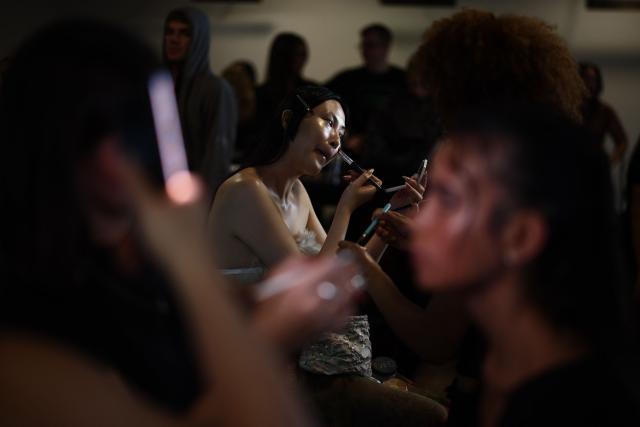 Models are prepared backstage ahead of the catwalk show for the DI PETSA Spring/Summer 2027 collection at London Fashion Week in London on September 21, 2026. (Photo by Henry Nicholls / AFP)