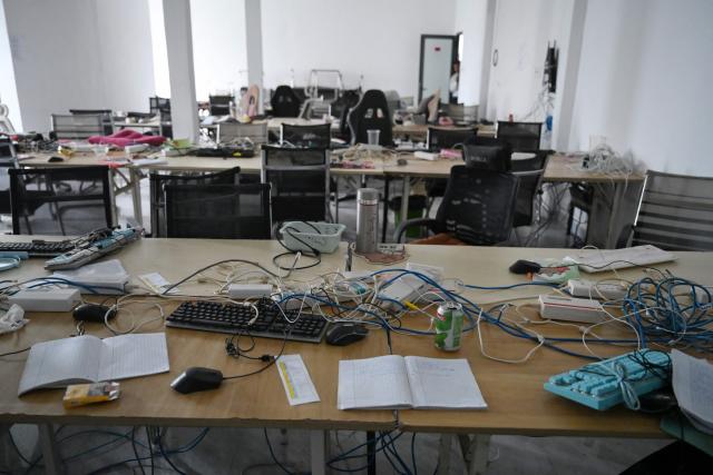 Abandoned equipment is seen in a room at a closed cyber scam centre in Bavet town, Svay Reang province on September 21, 2026. Cambodia this week hosts officials from more than 20 countries for a conference on combating online scammers, seeking to showcase its own crackdown under increasing international pressure. (Photo by TANG CHHIN SOTHY / AFP)