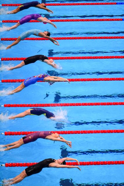 Swimmers compete in the final of the women's 50m backstroke swimming event during the 2026 Asian Games at the Tokyo Aquatics Centre in Tokyo on September 21, 2026. (Photo by Yuichi YAMAZAKI / AFP)
