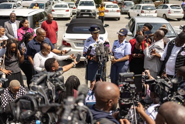 Deputy National Police Commissioner responsible for Policing, Lieutenant General Tabelo Mosikili (C) gives a press conference outside the Boksburg Magistrate Court in Boksburg on September 21, 2026 ahead of the first court appearance of three people accused of the murder of a woman whose body was found in the east of Johannesburg. South African police said on September 20 they had arrested three people over the killing of one of nine women found dead in a neighbourhood east of Johannesburg in a series of murders that have alarmed the nation. The discovery of the nine bodies in Kempton Park over two months has fuelled fear and anger, as authorities investigate whether a serial killer or killers were responsible. (Photo by EMMANUEL CROSET / AFP)