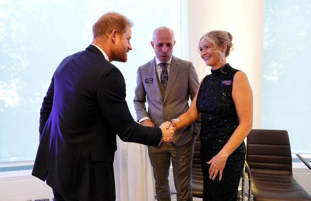 Britain's Prince Harry, Duke of Sussex (L) meets with the winners of the Inspirational Parent Carer, Carl and Sarah, during the annual WellChild Awards at the Royal Lancaster Hotel in London on September 21, 2026. WellChild is the national charity for seriously ill children and their families. The WellChild Awards celebrate the inspiring qualities of some of the country's seriously ill young people and the dedication of those who care for and support them. (Photo by Aaron Chown / POOL / AFP)