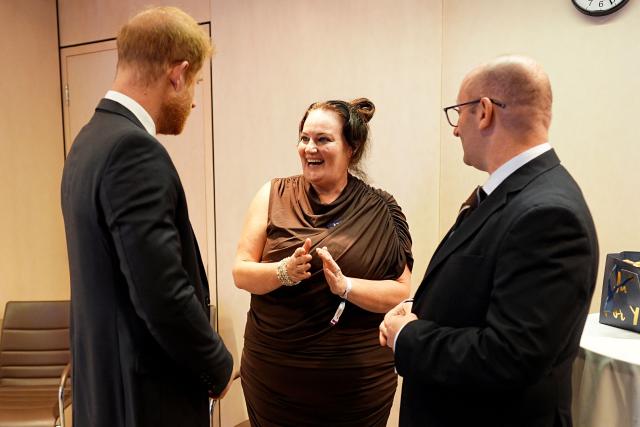 Britain's Prince Harry, Duke of Sussex (L) meets with the winner of the Inspirational Nurse, Rachel Shanahan (C) and her husband Paul, during the annual WellChild Awards at the Royal Lancaster Hotel in London on September 21, 2026. WellChild is the national charity for seriously ill children and their families. The WellChild Awards celebrate the inspiring qualities of some of the country's seriously ill young people and the dedication of those who care for and support them. (Photo by Aaron Chown / POOL / AFP)