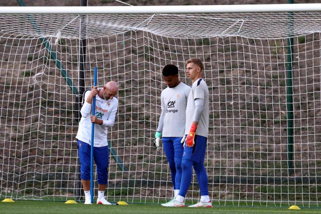 Goalkeeping coach Fabien Barthez (L) speaks with France's goalkeeper Guillaume Restes (C) and France's goalkeeper Jean Butez (R) during a training session four days ahead of France's UEFA Nations League football match against Turkey in Clairefontaine-en-Yvelines outside Paris, on September 21, 2026. The gathering is the first of the French national team under its new coach Zinedine Zidane, appointed on July 28, 2026 on a four-year contract. The Nations League, which France won in 2021, will dominate Zidane's attention in the coming months before the draw for the Euro 2028 qualifying tournament takes place in early December. (Photo by FRANCK FIFE / AFP)