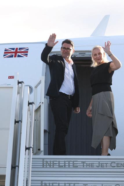 Britain's Prime Minister Andy Burnham and his wife Marie-France van Heel board a plane for the United States, to attend the 81st United Nations General Assembly (UNGA) in New York City, at Stansted Airport, north of London on September 21, 2026. (Photo by Toby Melville / POOL / AFP)
