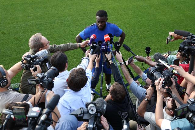 France's defender Dayot Upamecano (C) answers journalists' questions after a training session four days ahead of France's UEFA Nations League football match against Turkey in Clairefontaine-en-Yvelines outside Paris, on September 21, 2026. The gathering is the first of the French national team under its new coach Zinedine Zidane, appointed on July 28, 2026 on a four-year contract. The Nations League, which France won in 2021, will dominate Zidane's attention in the coming months before the draw for the Euro 2028 qualifying tournament takes place in early December. (Photo by FRANCK FIFE / AFP)