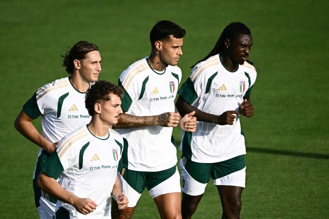 (From R) Italy's forwards  Moise Kean, Gianluca Scamacca, Sebastiano Esposito and Pio Esposito run during a trainig session ahead of Italy's UEFA Nations League football match against Belgium, in Coverciano, near Florence, on September 21, 2026. (Photo by Filippo MONTEFORTE / AFP)