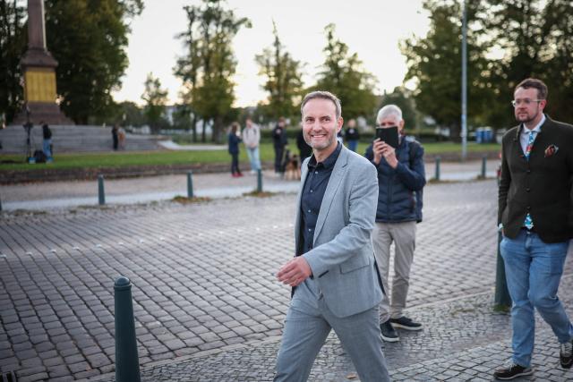 Co-chair of the far-right Alternative for Germany (AfD) party in Mecklenburg-Western-Pomerania Enrico Schult (L) leaves the TV compound after the announcement of the first exit poll results near the Schwerin Castle, on September 20, 2026, following north-eastern Germany's Mecklenburg-Western-Pomerania's state elections. (Photo by Ronny HARTMANN / AFP)