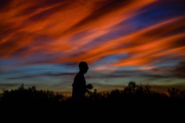 A jogger runs at sunset in Portirages, southern France, on September 21, 2026. (Photo by Gabriel BOUYS / AFP)