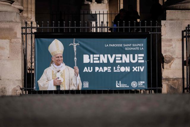 This photograph taken in Paris on September 21, 2026 shows a banner reading "The Saint-Sulpice parish welcomes Pope Leo XIV" at the entrance of Saint-Sulpice church, four days ahead of the pontiff's apostolic visit to Paris. (Photo by Simon WOHLFAHRT / AFP)