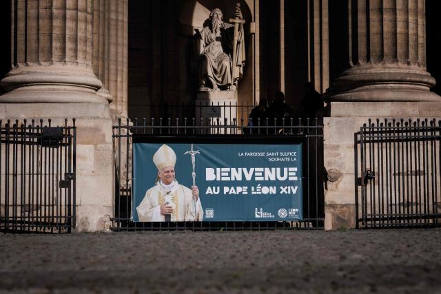 This photograph taken in Paris on September 21, 2026 shows a banner reading "The Saint-Sulpice parish welcomes Pope Leo XIV" at the entrance of Saint-Sulpice church, four days ahead of the pontiff's apostolic visit to Paris. (Photo by Simon WOHLFAHRT / AFP)