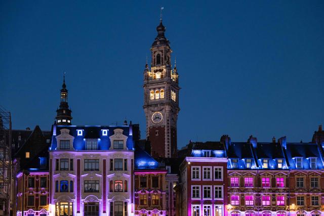 This photograph shows the Beffroi de la Chambre de Commerce illuminated at night in Lille, northern France, on September 21, 2026. (Photo by Sameer Al-DOUMY / AFP)