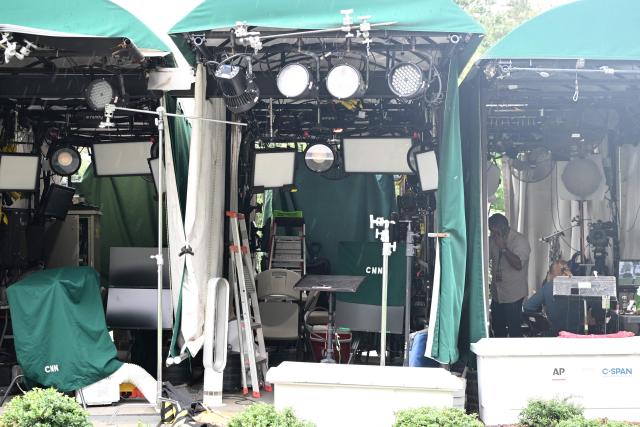 CNN equipment is seen near the White House in Washington, DC, on September 21, 2026. Three leading US news outlets announced on September 21 they will go to court after being banned from the White House, as President Donald Trump claimed that media critical of his administration is a "Cancer" threatening national security. CNN, MS NOW and Politico said in a joint statement that they were filing suit after Trump last week ordered them to be barred from the presidential complex. (Photo by Alex WROBLEWSKI / AFP)