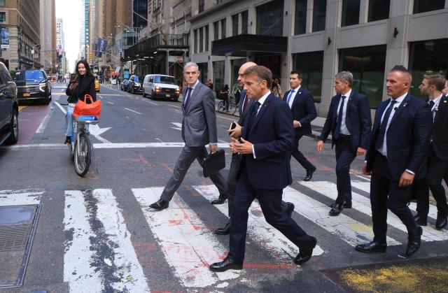 French President Emmanuel Macron (R) walks with Jerome Bonnafont (L), Permanent Representative of France to the United Nations and France’s Foreign Affairs Minister Jean-Noлl Barrot (C) as they head to Trump Tower in New York City on September 21, 2026, ahead of a meeting with US President Donald Trump. (Photo by Ludovic MARIN / AFP)