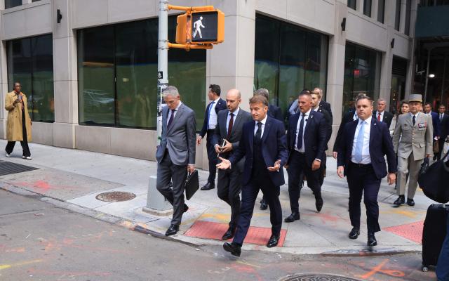 French President Emmanuel Macron (R) walks with Jerome Bonnafont (L), Permanent Representative of France to the United Nations and France’s Foreign Affairs Minister Jean-Noлl Barrot (C) as they head to Trump Tower in New York City on September 21, 2026, ahead of a meeting with US President Donald Trump. (Photo by Ludovic MARIN / AFP)