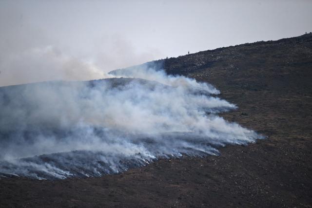 Smoke rises from a wildfire on Ritoque Hill in the municipality of Villa de Leyva, Boyaca department, Colombia, on September 21, 2026. (Photo by Raul ARBOLEDA / AFP)