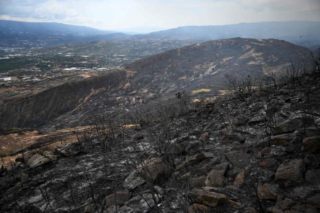 A general view shows an area charred by a wildfire on Ritoque Hill in the municipality of Villa de Leyva, Boyaca department, Colombia, on September 21, 2026. (Photo by Raul ARBOLEDA / AFP)