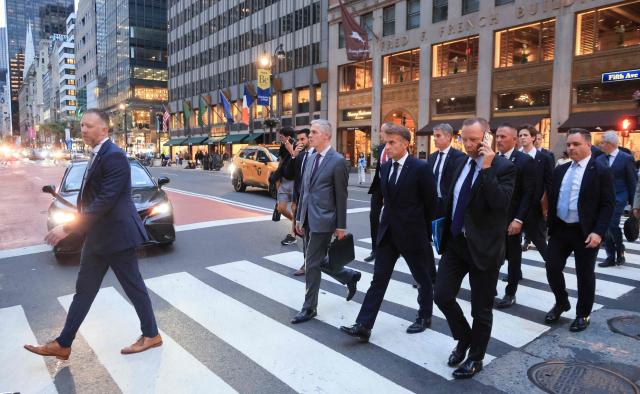 French President Emmanuel Macron walks with Jerome Bonnafont (L), Permanent Representative of France to the United Nations after a meeting with US President Donald Trump at Trump Tower in New York City on September 21, 2026. (Photo by Ludovic MARIN / AFP)
