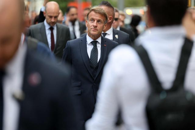 France's Foreign Affairs Minister Jean-Noel Barrot (L) and France's President Emmanuel Macron walk in New York City on September 21, 2026, after a meeting with US President Donald Trump. (Photo by Ludovic MARIN / AFP)