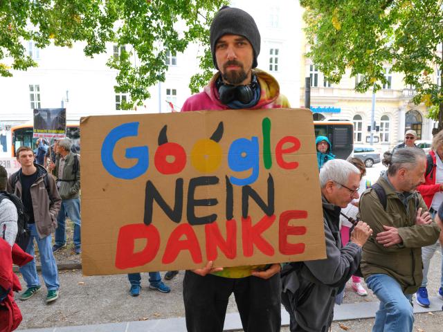 A man attends a protest in the city of Linz, Austria on September 11, 2026, against the construction of new Google’s data centre in the Upper Austrian town of Kronstorf. A planned Google data centre promises investment, jobs and a place on the digital map. But not everyone is convinced and local residents have staged potests against the centre. (Photo by Joe Klamar / AFP)