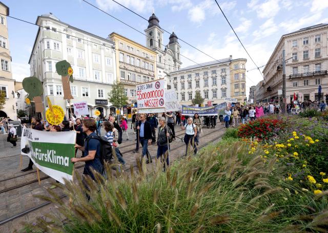 People attend a protest in the city of Linz, Austria on September 11, 2026, against the construction of new Google’s data centre in the Upper Austrian town of Kronstorf. A planned Google data centre promises investment, jobs and a place on the digital map. But not everyone is convinced and local residents have staged potests against the centre. (Photo by Joe Klamar / AFP)