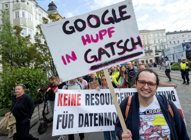 People attend a protest in the city of Linz, Austria on September 11, 2026, against the construction of new Google’s data centre in the Upper Austrian town of Kronstorf. A planned Google data centre promises investment, jobs and a place on the digital map. But not everyone is convinced and local residents have staged potests against the centre. (Photo by Joe Klamar / AFP)