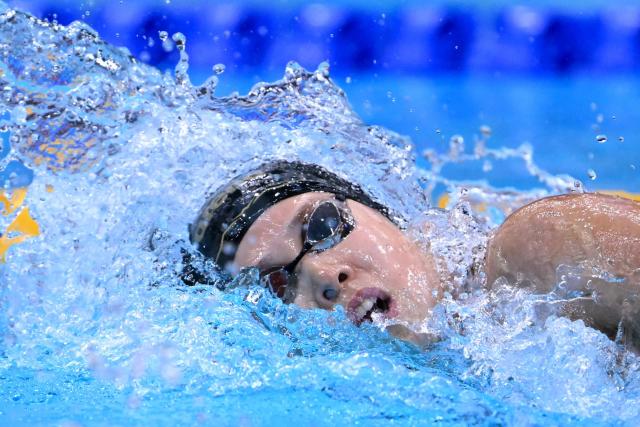 Japan's Nagisa Ikemoto competes in a heat of the women's 100m freestyle swimming event during the 2026 Asian Games at the Tokyo Aquatics Centre in Tokyo on September 22, 2026. (Photo by Yuichi YAMAZAKI / AFP)