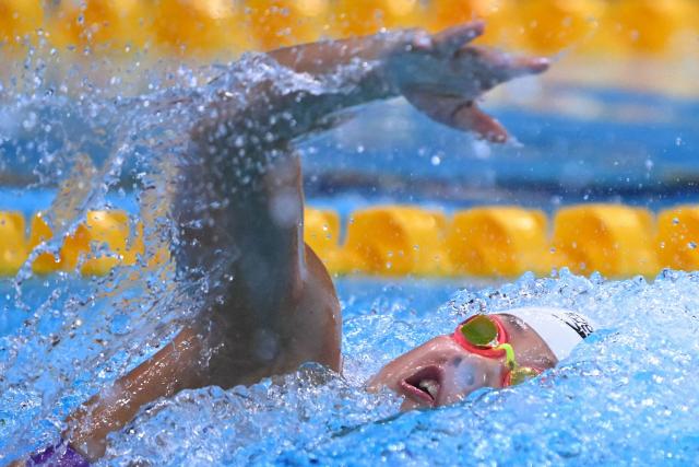 China's Yu Yiting competes in a heat of the women's 100m freestyle swimming event during the 2026 Asian Games at the Tokyo Aquatics Centre in Tokyo on September 22, 2026. (Photo by Yuichi YAMAZAKI / AFP)