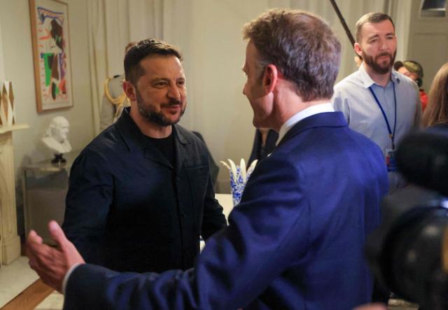 France's President Emmanuel Macron greets Ukraine's President Volodymyr Zelensky (R) as they meet on the sidelines of the 81st United Nations General Assembly in New York City on September 21, 2026. (Photo by Ludovic MARIN / AFP)