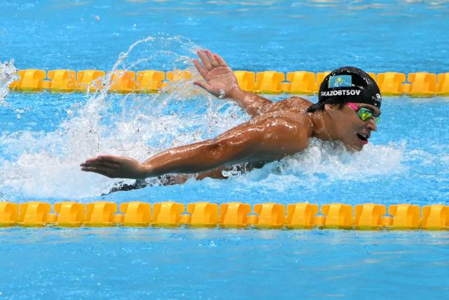 Kazakhstan's Maxim Klimenko competes in a heat of the men's 4 x 100m medley relay swimming event during the 2026 Asian Games at the Tokyo Aquatics Centre in Tokyo on September 22, 2026. (Photo by ANDREW CABALLERO-REYNOLDS / AFP)