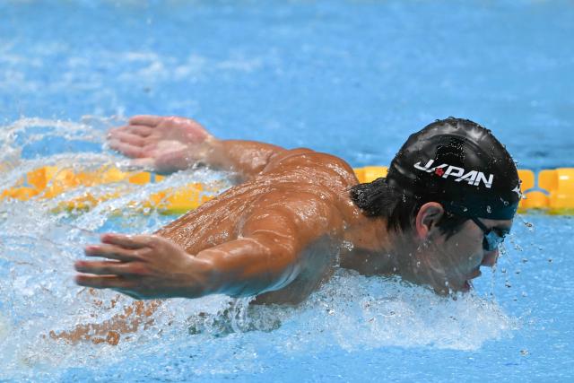 Japan's Shoon Mitsunaga competes in a heat of the men's 4 x 100m medley relay swimming event during the 2026 Asian Games at the Tokyo Aquatics Centre in Tokyo on September 22, 2026. (Photo by ANDREW CABALLERO-REYNOLDS / AFP)
