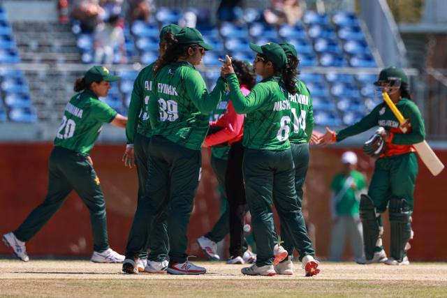 Pakistan's players celebrate their victory in the women's bronze medal cricket match between Bangladesh and Pakistan during the 2026 Asian Games at Korogi Athletic Park in Nisshin, Aichi prefecture on September 22, 2026. (Photo by DAVID GRAY / AFP)