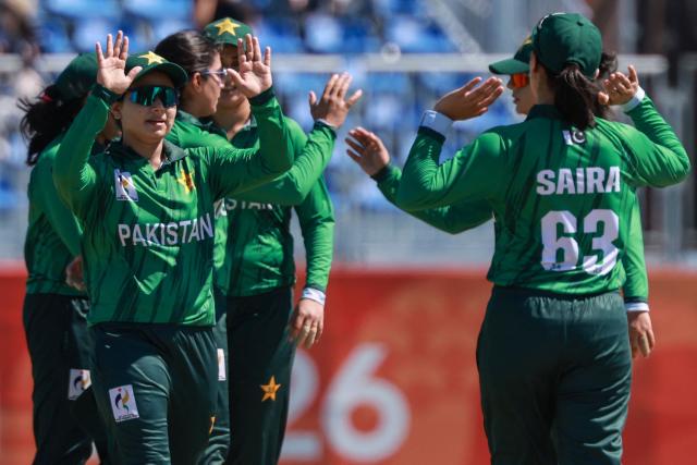 Pakistan's players celebrate their victory in the women's bronze medal cricket match between Bangladesh and Pakistan during the 2026 Asian Games at Korogi Athletic Park in Nisshin, Aichi prefecture on September 22, 2026. (Photo by DAVID GRAY / AFP)