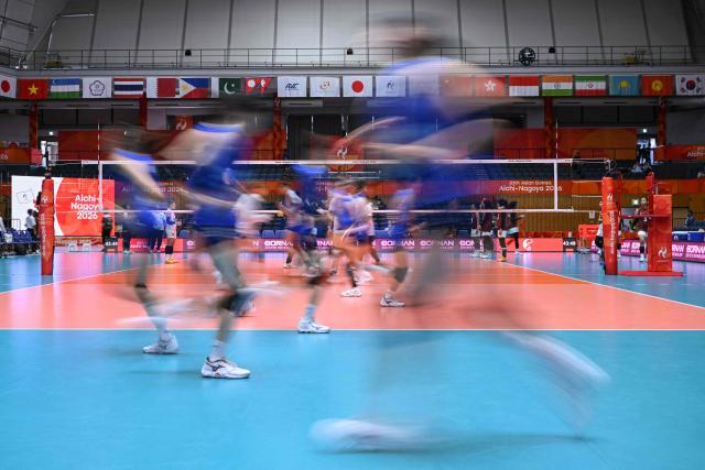 Taiwan's players warm-up before the women's volleyball match between Taiwan and Indonesia during the 2026 Asian Games at the Park Arena Komaki in Komaki, Aichi prefecture on September 22, 2026. (Photo by MOHD RASFAN / AFP)