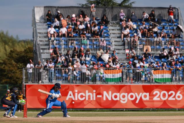 India's Richa Ghosh plays a shot in front of Sri Lanka's wicketkeeper Kaushini Nuthyangana in the women's gold medal cricket match between India and Sri Lanka during the 2026 Asian Games at Korogi Athletic Park in Nisshin, Aichi prefecture on September 22, 2026. (Photo by DAVID GRAY / AFP)