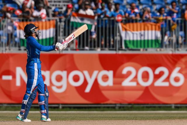 India's Smriti Mandhana hits a six in the women's gold medal cricket match between India and Sri Lanka during the 2026 Asian Games at Korogi Athletic Park in Nisshin, Aichi prefecture on September 22, 2026. (Photo by DAVID GRAY / AFP)