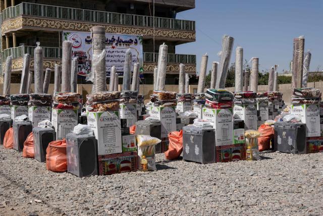 Dowry gifts donated by a charity foundation for Afghan grooms during a mass marriage ceremony outside a wedding hall in Afghanistan's Farah province on September 21, 2026. (Photo by Mohsen KARIMI / AFP)