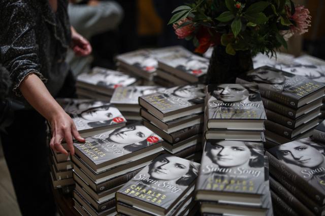 Copies of "Swan Song: Diana, My Sister", Charles Spencer's book about his late sister Princess Diana, are unboxed at a bookstore in central London on September 22, 2026. The book, reportedly packed with explosive revelations, was published on September 22 after searing extracts prompted a rare and sharp rebuttal from Britain's King Charles III. Almost three decades after Diana was killed in a car crash in Paris in 1997, people remain fascinated by her life and tragic death. (Photo by Henry Nicholls / AFP)