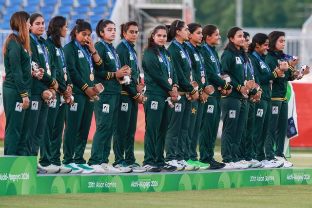 Bronze medallists Pakistan stand on the podium for the women's cricket event during the 2026 Asian Games at Korogi Athletic Park in Nisshin, Aichi prefecture on September 22, 2026. (Photo by DAVID GRAY / AFP)