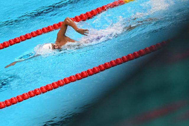China's Zhang Zhanshuo competes in the final A of the men's 1500m freestyle swimming event during the 2026 Asian Games at the Tokyo Aquatics Centre in Tokyo on September 22, 2026. (Photo by ANDREW CABALLERO-REYNOLDS / AFP)