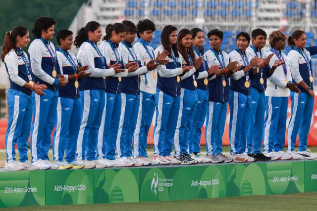 Gold medallists India stand on the podium for the women's cricket event during the 2026 Asian Games at Korogi Athletic Park in Nisshin, Aichi prefecture on September 22, 2026. (Photo by DAVID GRAY / AFP)