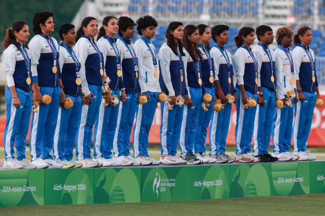 Gold medallists India stand on the podium for the women's cricket event during the 2026 Asian Games at Korogi Athletic Park in Nisshin, Aichi prefecture on September 22, 2026. (Photo by DAVID GRAY / AFP)